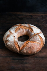 Sourdough bread. Freshly baked organic wheat bread on a dark background. 