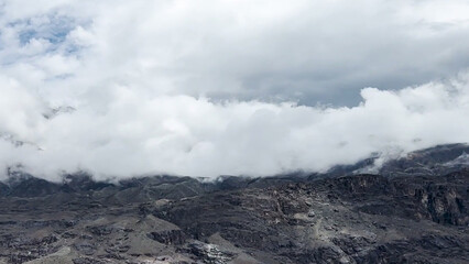 clouds over the mountains  Mountain peak dark white clouds cold green weather 