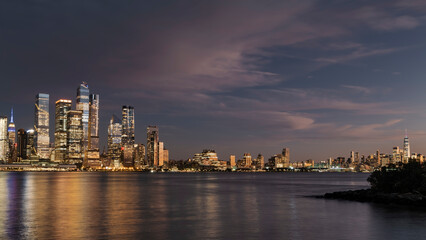 Fototapeta na wymiar Panoramic skyline and modern commercial buildings. Cityscape of Manhattan NYC at sunset. High-quality photo
