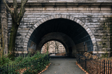 Fototapeta na wymiar Bridge in Riverside Drive, Upper Manhattan, arch walk road underneath. High-quality photo
