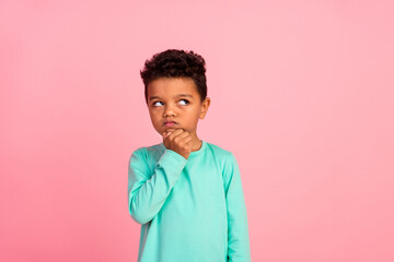 Photo portrait of adorable little boy look unsure moody empty space wear trendy aquamarine garment...