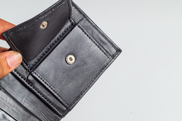 Closeups of black leather wallet on white background.