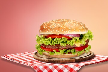 Tasty fresh fast food Hamburger on desk