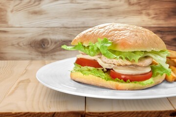 Tasty fresh fast food Hamburger on desk