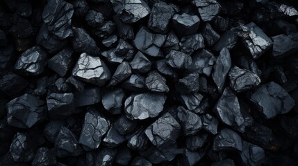 A close up of black rocks with a dark and moody atmosphere - obrazy, fototapety, plakaty
