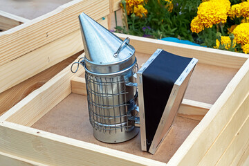 A bee smoker is the device beekeepers use to puff smoke into their hives