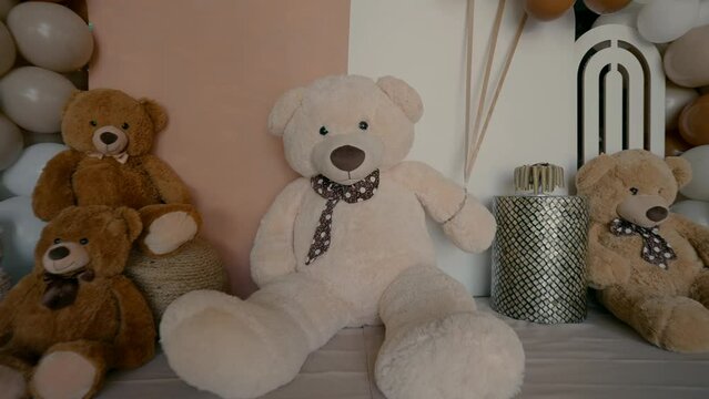 Bears and balloons celebrating circumcision in an event hall. High quality FullHD footage