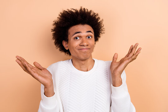 Photo of funny man wear white stylish clothes raise hand no answer oops sorry mistake problem isolated on beige color background