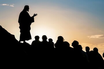 Fototapeta na wymiar Silhouette of Jesus Christ teaching from a hilltop, crowd of people listening below.
