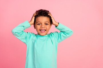 Photo portrait of cute little boy touch head shocked reaction wear trendy aquamarine clothes isolated on pink color background