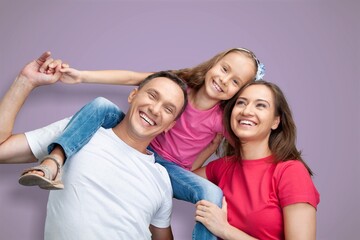 Obraz premium Young cool happy parents with child