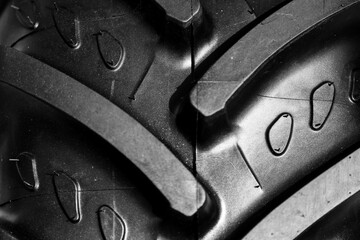 Detail shot with brand new tractor tire. Treads details. - 764156074