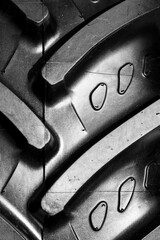 Detail shot with brand new tractor tire. Treads details. - 764156085