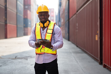 African logistic engineer man worker or foreman working with container at container site	 - 764160623