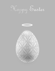 Minimalistic Easter greeting card in gray and silver colors with an Easter egg with a halo decorated with an Easter pattern