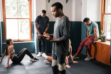 Group of people sharing gym space, building muscle with arm and leg exercises - Powered by Adobe