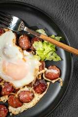 Fried egg and sliced sausage.