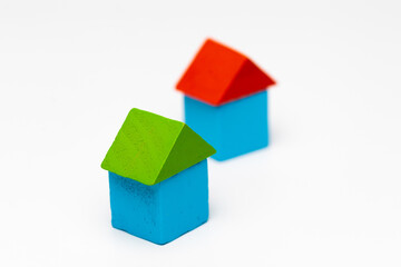 House made of old cubes. Wooden colorful building blocks isolated on white background. Vintage children toys.