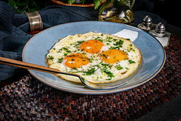Fried eggs with a slice of bread