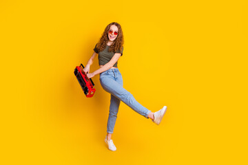 Fototapeta na wymiar Photo of positive glad nice funky girl celebrate holiday enjoy vacation weekend chill isolated on vivid yellow color background