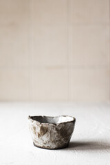 Ceramic tea bowl. Handmade ceramic sauce pan. Minimalism style. Front view. Japanese ceramics. Tea ceremony. Close-up.