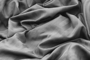 A crumpled fabric texture background. Black and white. Close up.