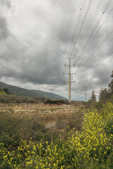 Obraz premium electric pole with wires against a dramatic sky