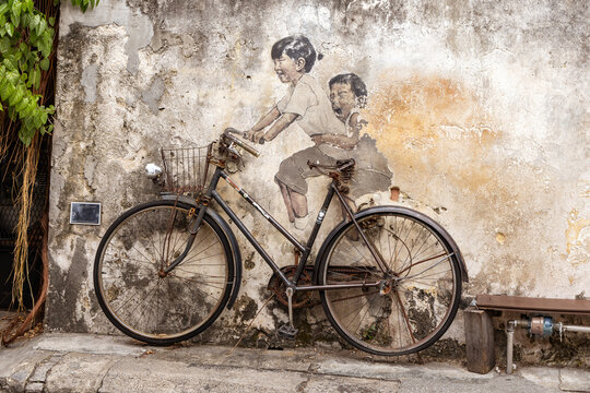 Little Children on a Bicycle mural on Armenian Street, George Town, Penang by Lithuanian artist Ernest Zacharevic.
