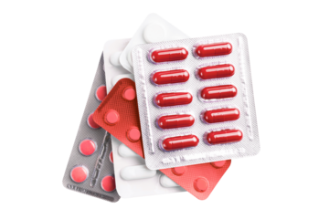 Various medicine capsules, pills and tablets in a blister pack isolated on transparent background, healthcare and medicine concept, top view
