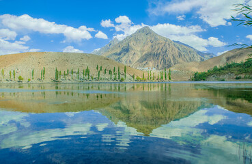 Beautiful reflection of mountains on lake in Ghizer valley Pakistan