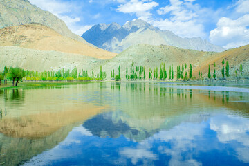 Beautiful reflection of mountains on lake in Ghizer valley Pakistan