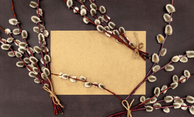 Flat lay blank brown craft paper and branches of Pussy willow Mockup Easter background.