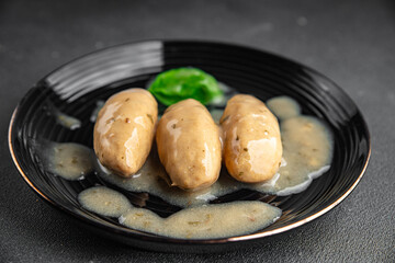 quenelles pork mushroom sauce canned food jar put food on a plate eating cooking appetizer meal food snack on the table copy space food background