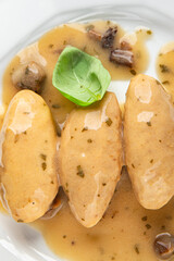quenelles pork mushroom sauce canned food jar put food on a plate eating cooking appetizer meal food snack on the table copy space food background