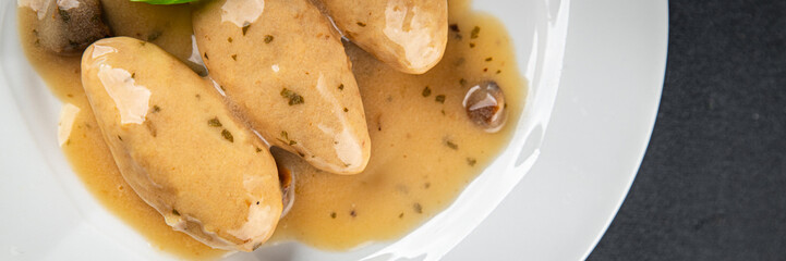 quenelles pork mushroom sauce canned food jar put food on a plate eating cooking appetizer meal food snack on the table copy space food background