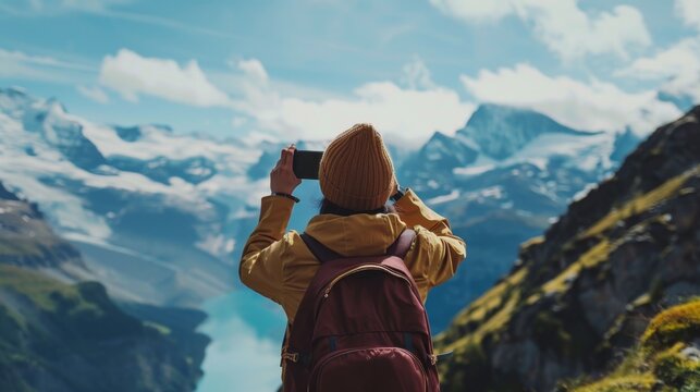 Person Capturing Picture of Mountain Range