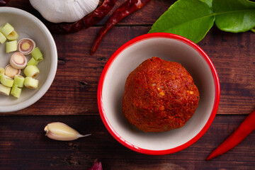 Thai red curry paste in white bowl,is a versatile and flavorful base for a variety of Thai...