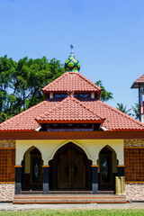 a portrait of the mosque in the middle of the village as a place of worship for Muslims