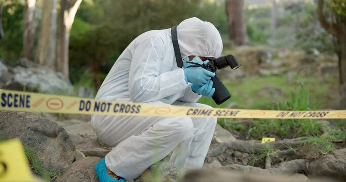 Forensic, photographer and police tape at crime scene for investigation in forest with evidence and safety hazmat..Csi quarantine, expert investigator and pictures for observation and case research