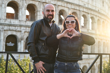 Happy  Beautiful Tourists  couple traveling at Rome, Italy, taking a selfie portrait in front   of...