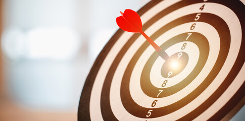 Red dart hitting on the target center dartboard, Business targeting or goal success and winner...