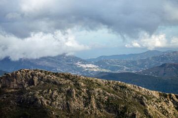 Panoramic view from hiking trail to Maroma peak in thunderstorm day, Sierra Tejeda, Spain 