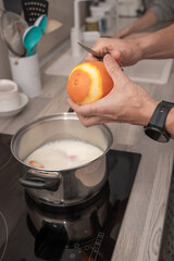Close-Up of Orange Zesting into Pot