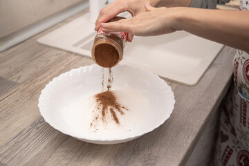 Cinnamon sprinkled on sugar for baking