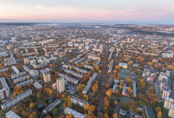 Obraz premium Zirmunai District in Vilnius City, Lithuania. Autumn Leaves Color. Morning Golden Hour Light.