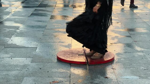 Spanish traditional flamenco. Dancer female flamenco dancing, close up feet of street flamenco dancers.