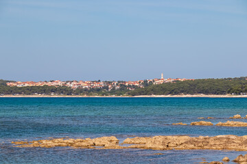 Fototapeta premium Panoramic view of coastal town Premantura seen from Medulin, Istria peninsula, Croatia, Europe. Idyllic coastline of Kvarner Gulf in Adriatic Mediterranean Sea. Travel destination in summer. Vacation