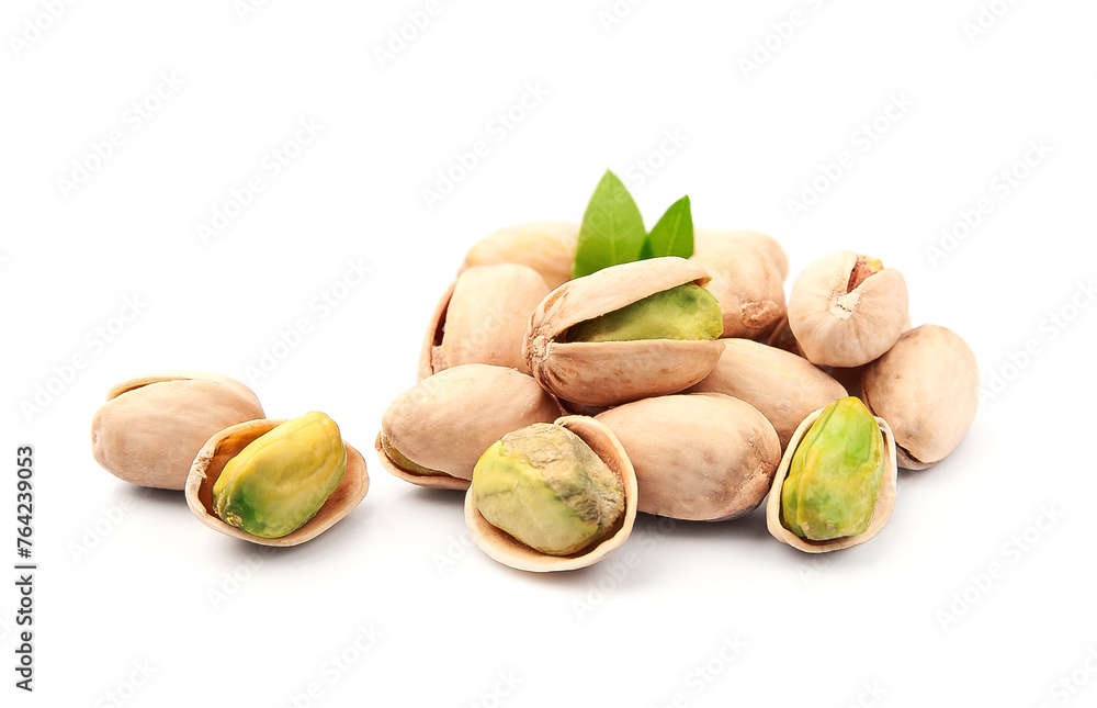 Wall mural Pistachio nuts with leaves on white backgrounds .