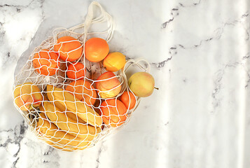 Dietary fruits in fabric packaging. Banner for store. Healthy natural products in eco bag to boost...