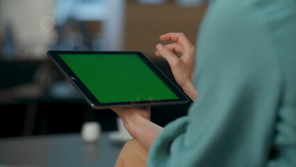 Unrecognized boss zoom out chromakey tablet lobby closeup. Hands touching screen